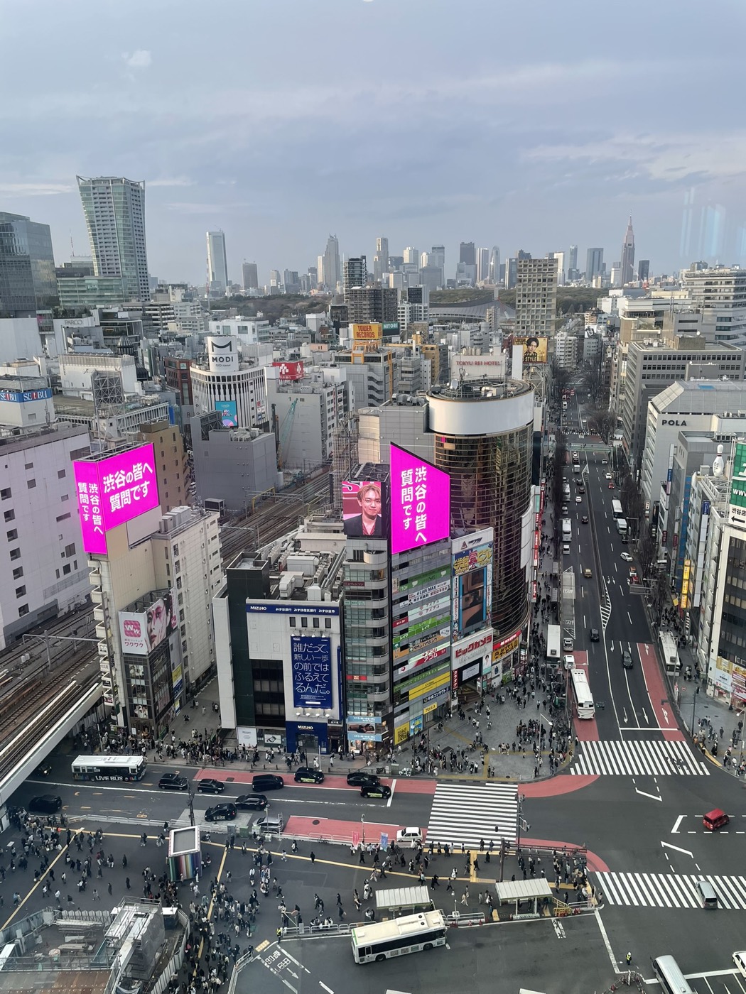 Shibuya seen from above, the scramble crossing and billboards below